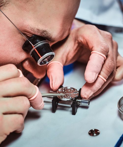 expirienced-clockmaster-is-fixing-old-watch-for-a-customer-at-his-repairing-workshop.jpg